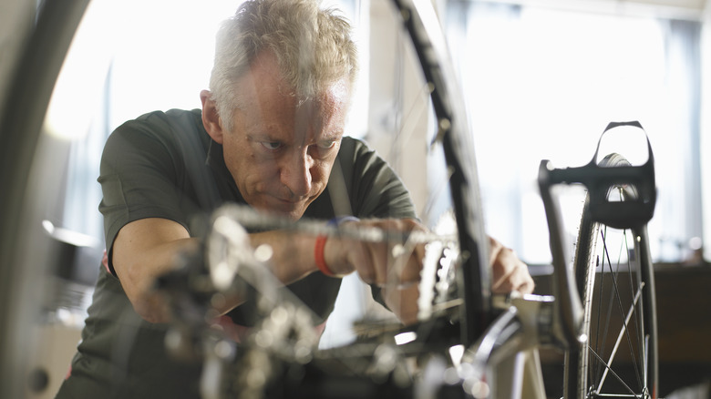 Cyclist working on his bike 