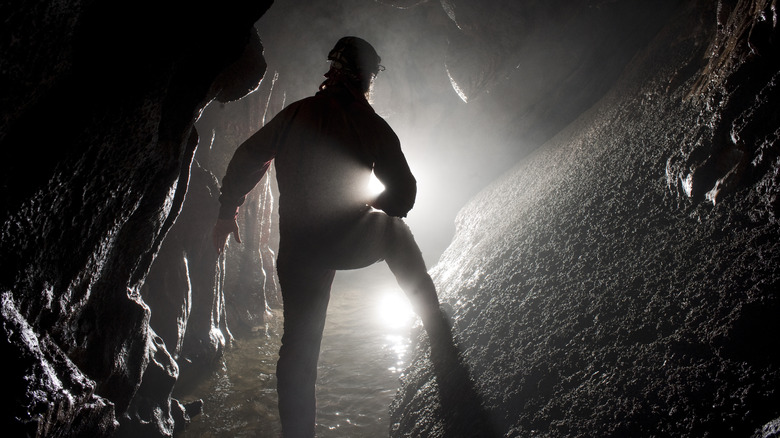 Scientist exploring a cave