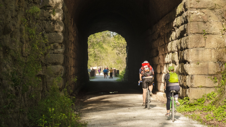 Cyclists going through tunnel on Katy Trail