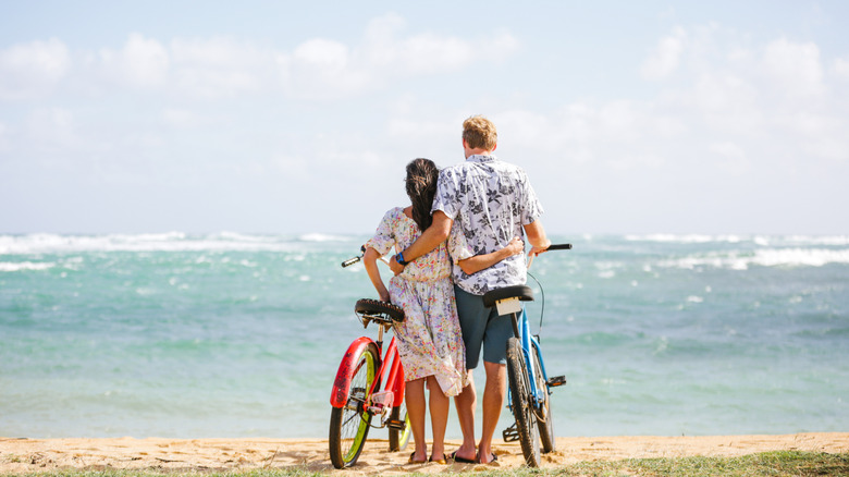 Couple with bikes by the beach