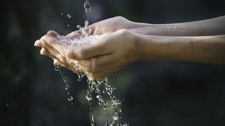 water dripping into hands