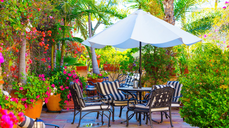 Outdoor seating area with patio table and umbrella