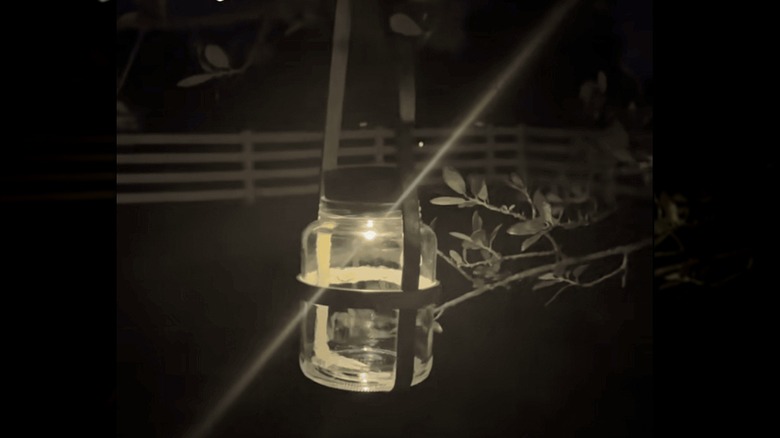 DIY jar lantern with belt hanger handle in tree