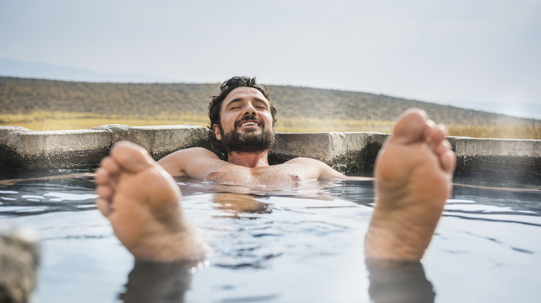 A man relaxing in hot tub