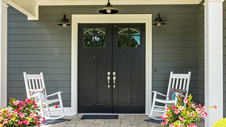 Exposed front porch with rocking chairs