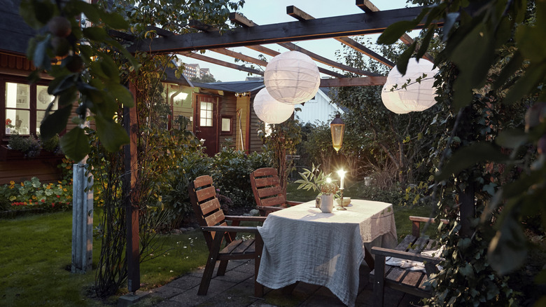 Pergola with seating and vines growing