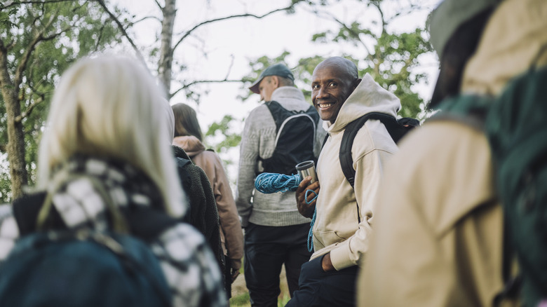 hiker looks back at friends