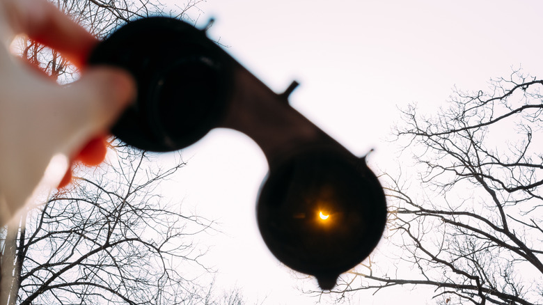 partial eclipse viewed through specialized glasses