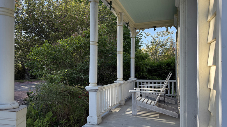 White front porch with Victorian-style columns