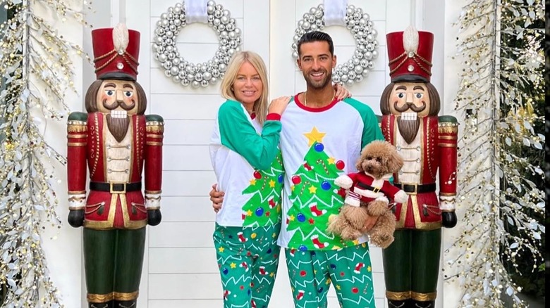 Caroline Stanbury and Sergio Carrallo on their front porch decorated for Christmas