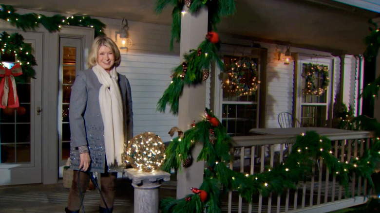 Martha Stewart on her front porch with a grapevine ball filled with lights