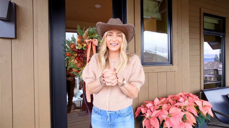 Jasmine Roth smiling in front of home