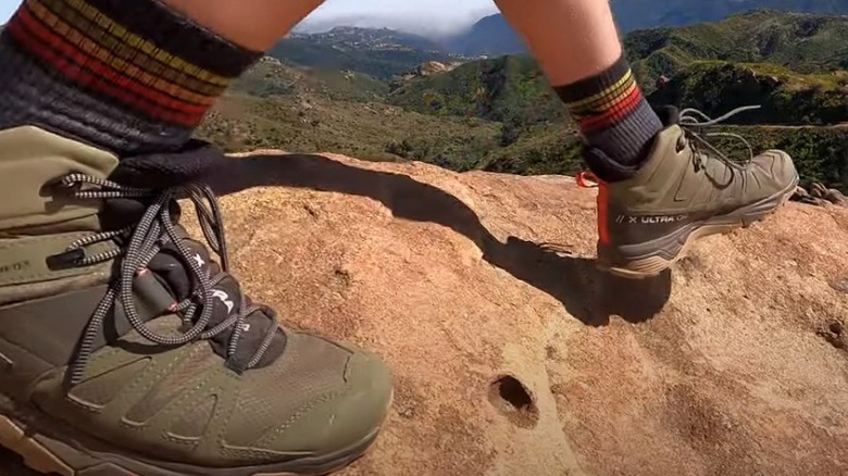 hiking on rocks in the Salomon X Ultra Mid GTX hiking boots.