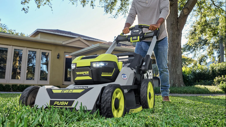 Man using Ryobi push mower