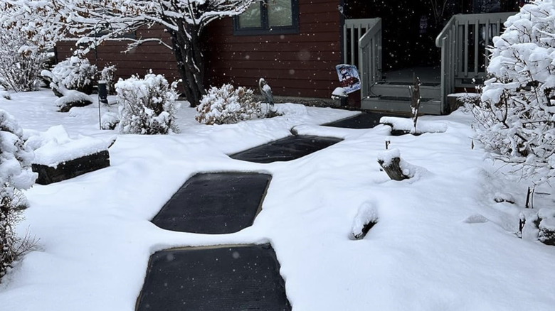 HeatTrak snow-melting mats on a sidewalk to a house