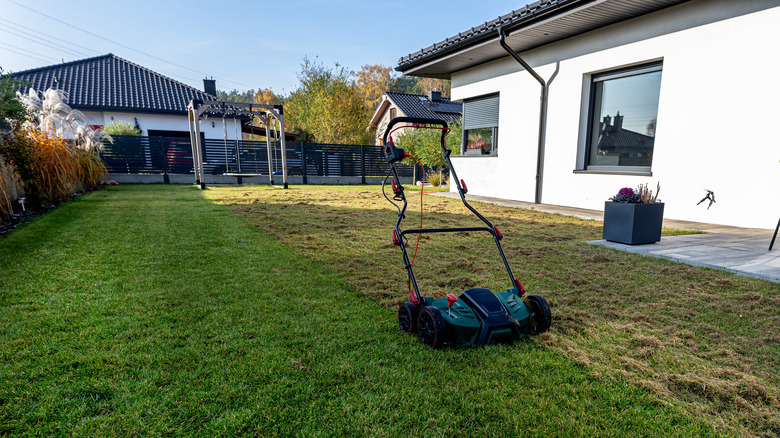 Aerator parked on a lawn in fall