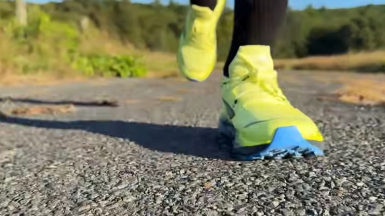 YouTuber trail running in Brooks Cascadia shoes