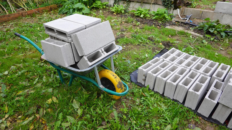 A wheelbarrow full of cinder blocks for an outdoor project