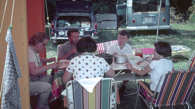 1960s family at a campsite table