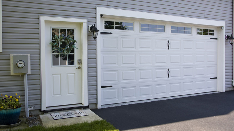 White garage door with decorative hinges and handles