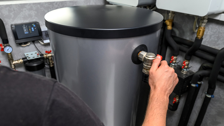 Plumber installing heat exchanger