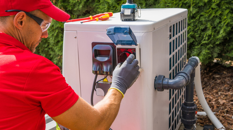 Gas heat pump being worked on
