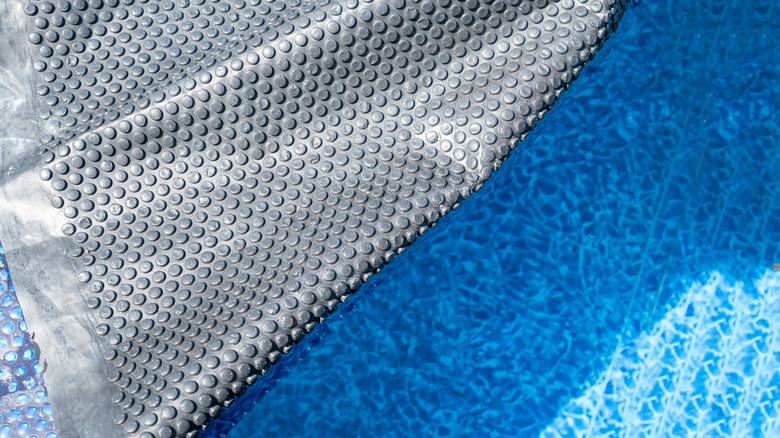 Removable solar pool cover