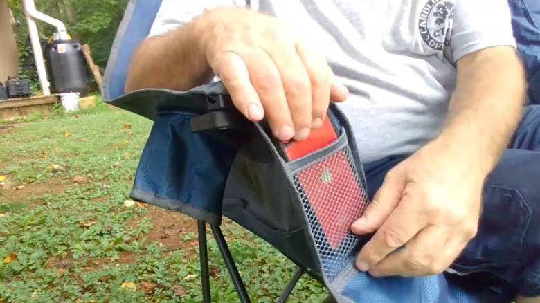 YouTuber Nick G using the MacSports double camping chair