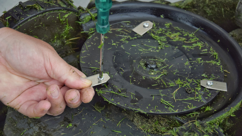 changing the blades on a robotic mower