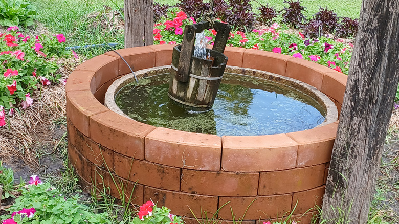 A brick-built pond in a garden