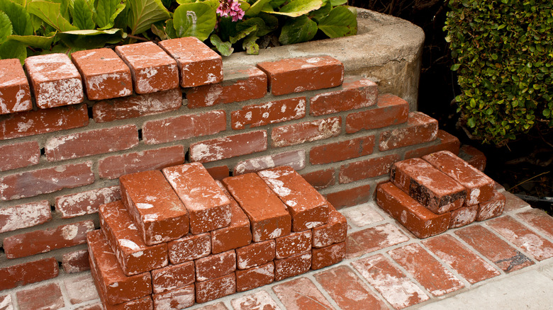 A brickwork project nearing completion in a garden