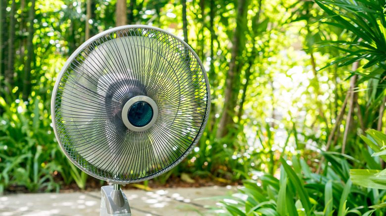 An oscillating fan in a garden