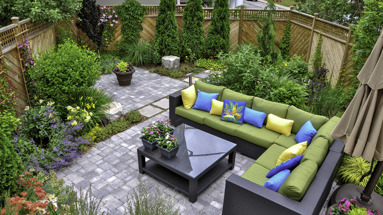 A patio space that uses much of the non-plant part of a small backyard