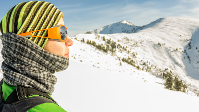 Hiker in mountains wearing a buff
