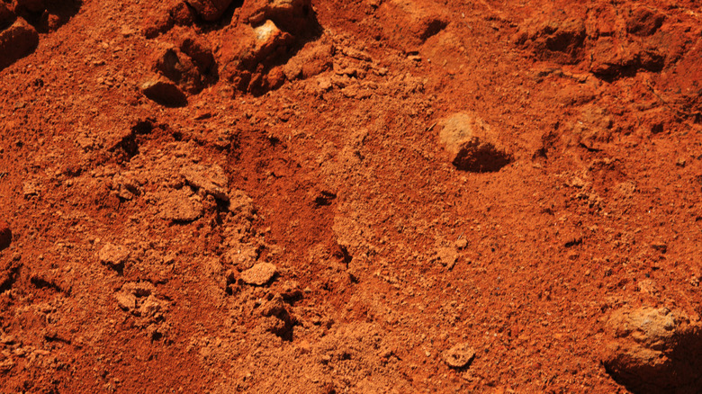 red, crumbly soil and rocks