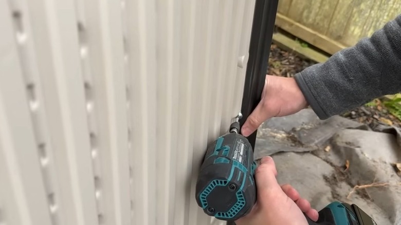 Person assembling the Lifetime shed