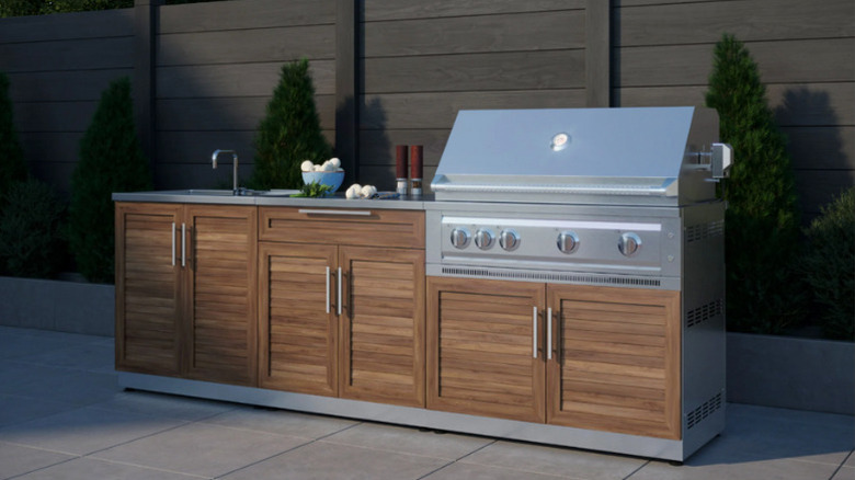 The 5-piece Grove Stainless Steel Outdoor Kitchen from New Age Products, complete with drop-in grill