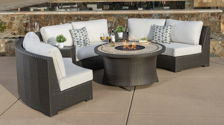 The Grand Leisure Sidney 6-piece fire outdoor patio seating set on a patio