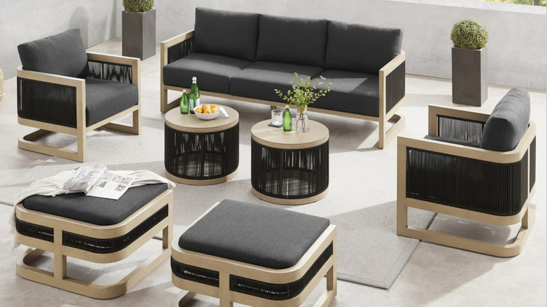 The Sirio Atlas 7-piece outdoor patio seating set on a modern patio