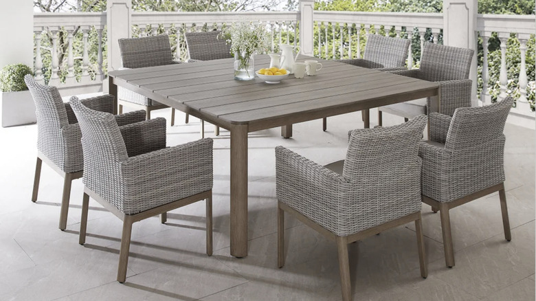 The Sirio Palermo 9-piece outdoor patio dining set on a patio
