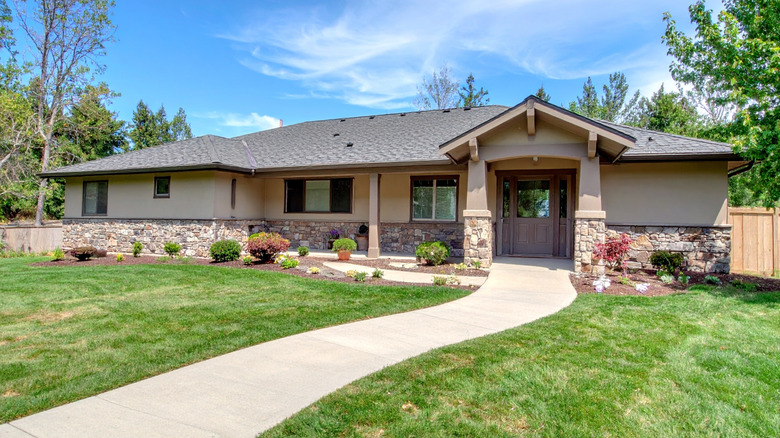 Landscaped front yard with a curving walkway