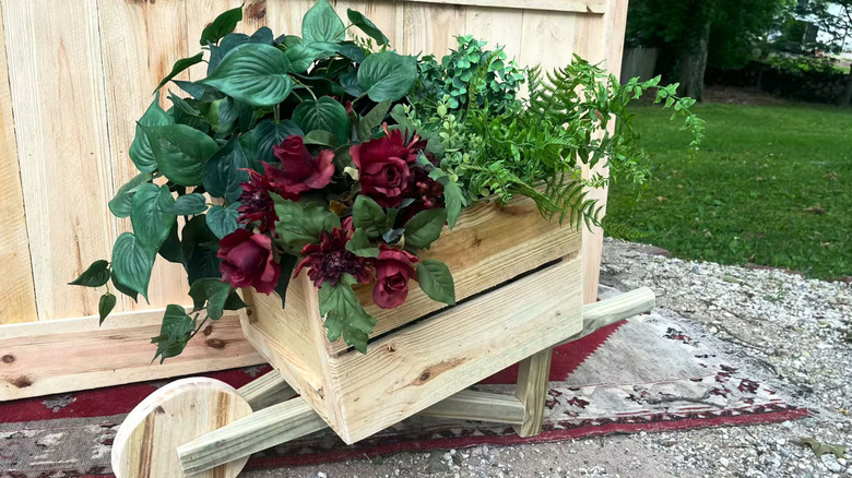 A wheelbarrow DIY plant from repurposed pickets tutorial
