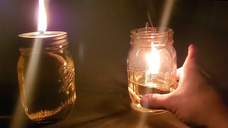 Lit olive oil mason jar lamps