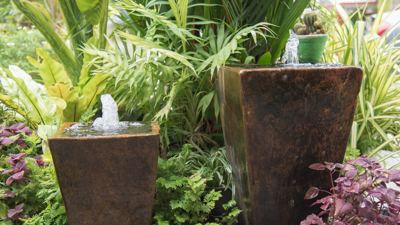 Tall flower pots turned into water features
