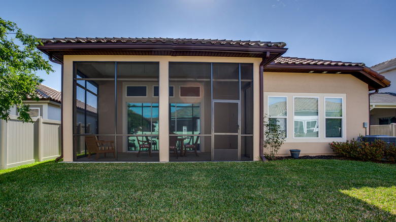 screened-in patio in backyard