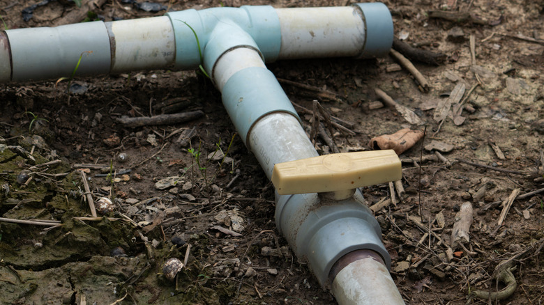 PVC pipes connected on top of bare agricultural earth