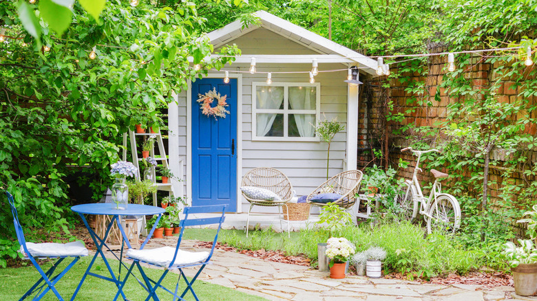 Cute garden shed decorated like a house
