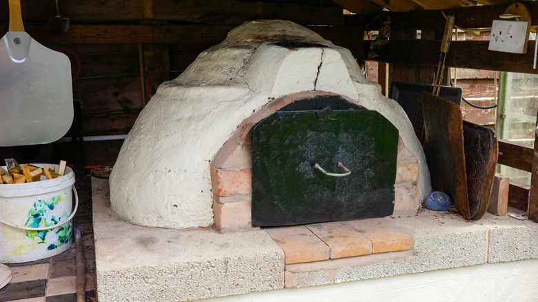 Homemade outdoor pizza oven with crack