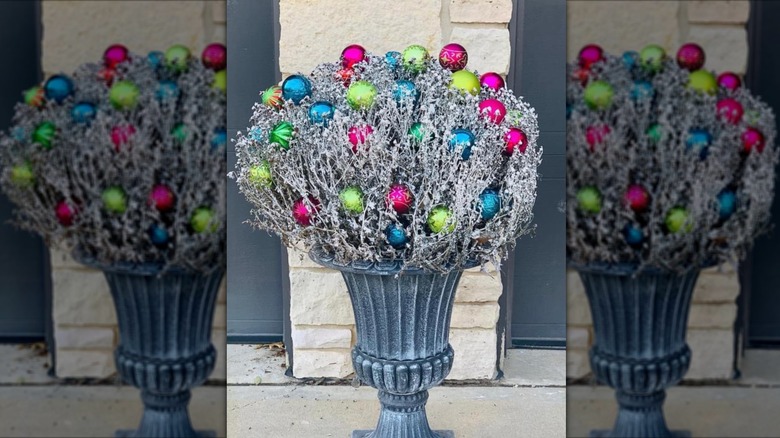 Mum plant spray-painted silver and decorated with Christmas ornaments