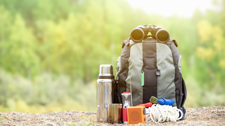 Backpack on summit with hiking gear around it